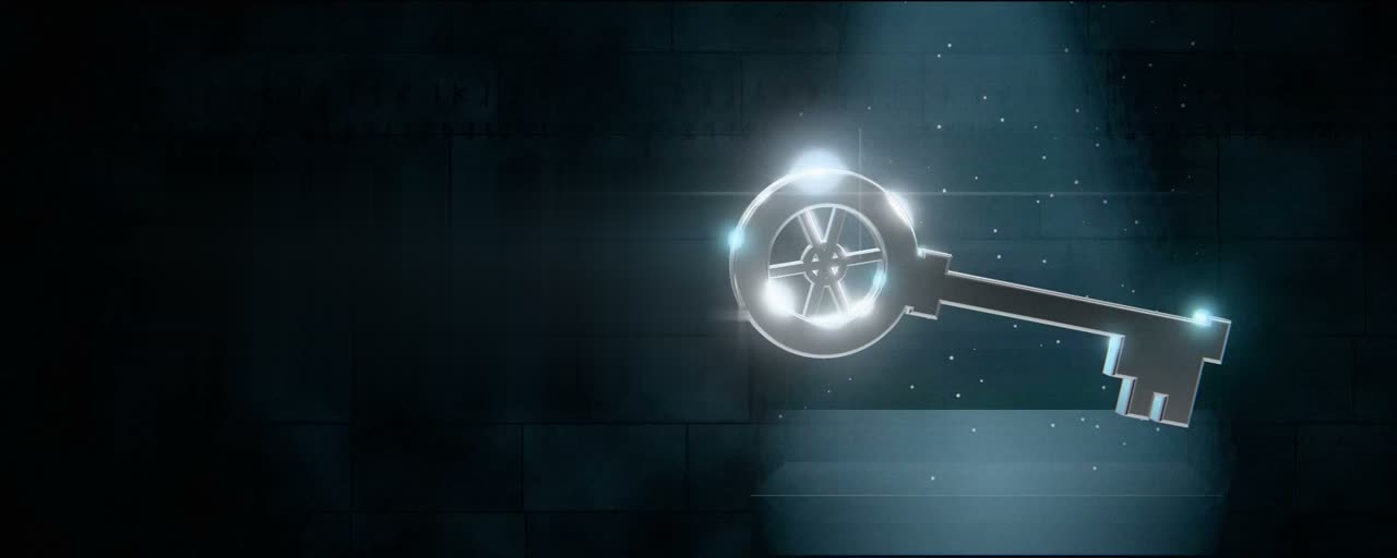 A glowing silver key floating in the dark